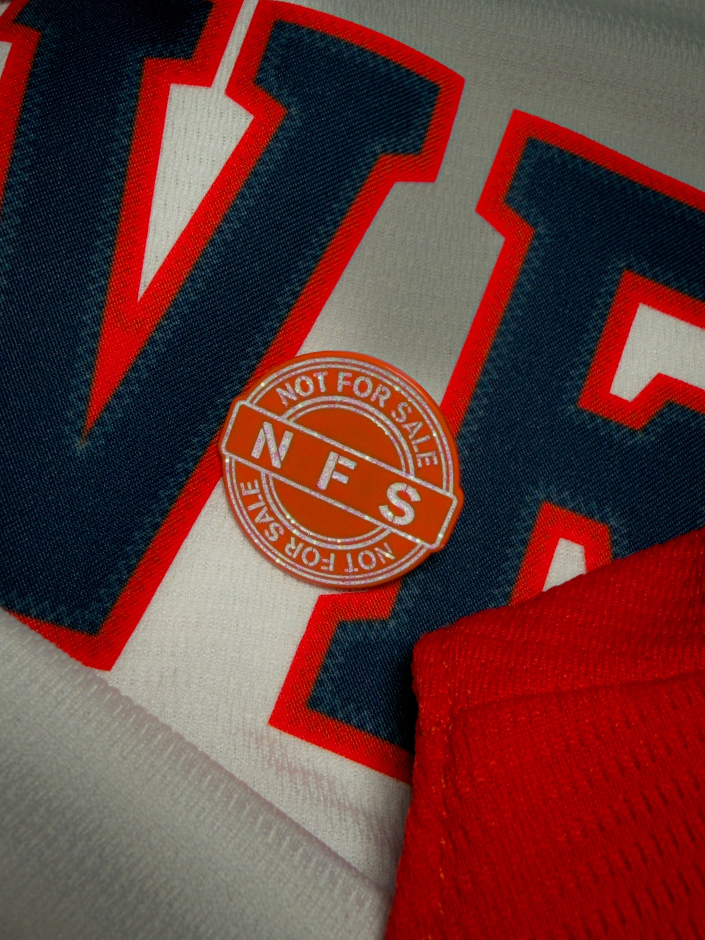 The NFS “Chase the fight” pin 🍊